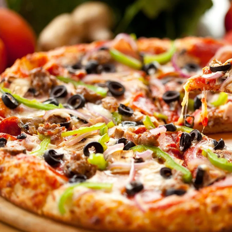 Authentic Italian-Indian fusion pizza freshly baked at Supreme Pizza Edmonton
